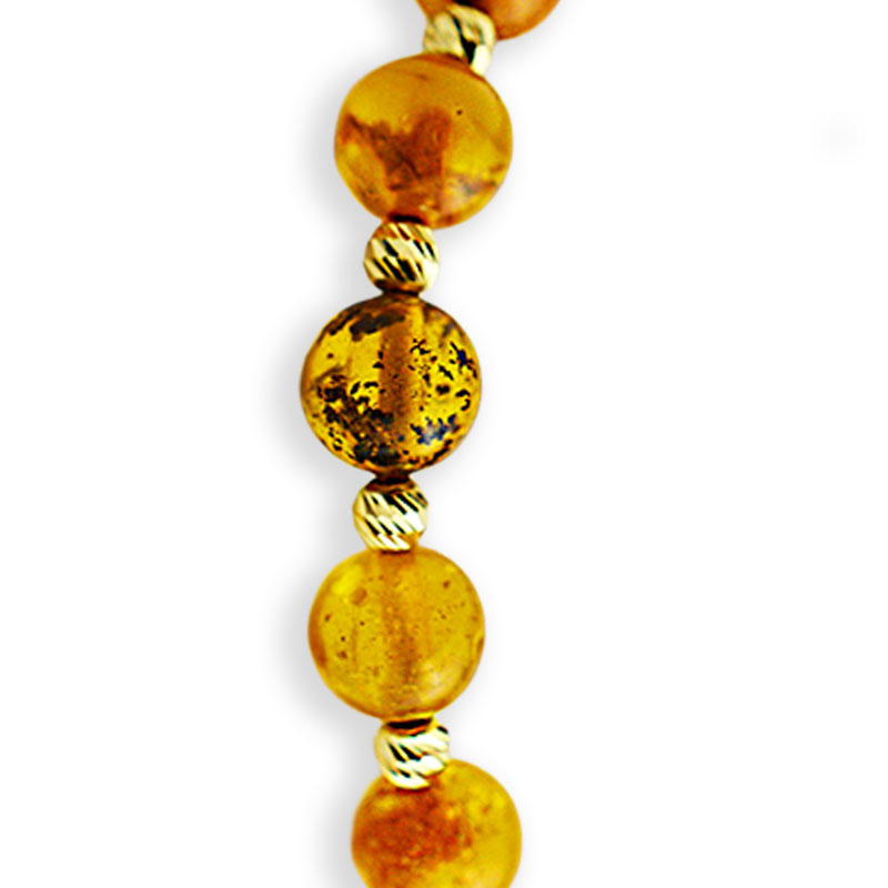 Златна гривна на конец с кехлибар