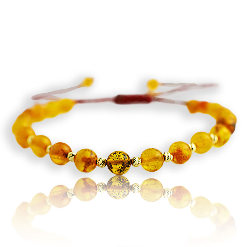 Златна гривна на конец с кехлибар